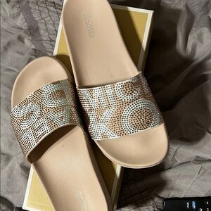 Light pink Michael Kors slides in GUC